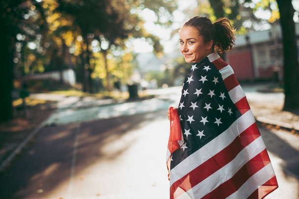 young woman with american flag  - Photo, Image