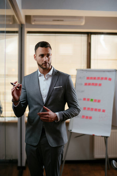 Businessman on meeting presenting new business strategy - Photo, Image