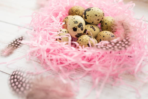Easter. Peepeline eggs in a pink nest. White background. - Φωτογραφία, εικόνα