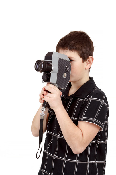 young boy with old vintage analog 8mm camera - Foto, Imagen