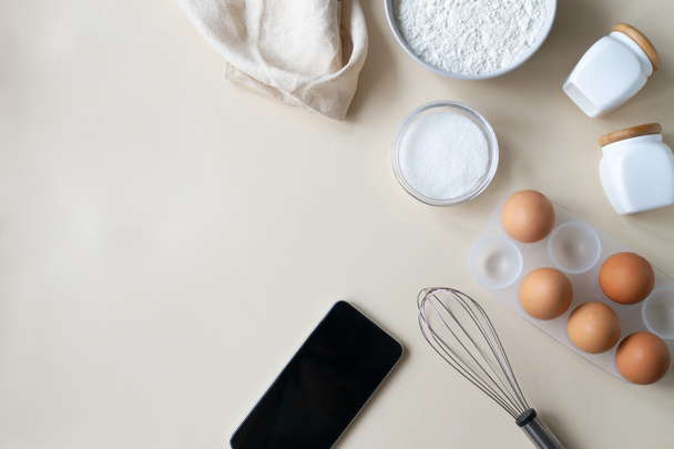 Online cooking courses. The smartphone is among the ingredients for cooking. Top view. Copy space. - Valokuva, kuva