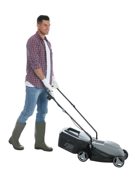 Man with modern lawn mower on white background - Foto, Imagem