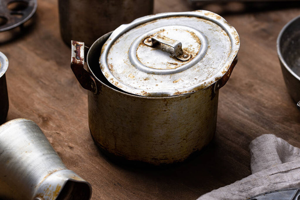Old vintage iron pots and metallic dish - Foto, Imagen