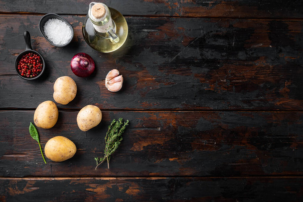 Fresh Pile of potatoes set, on old dark  wooden table background, top view flat lay , with space for text copyspace - Valokuva, kuva
