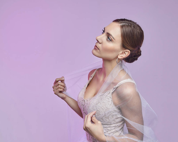portrait of a beautiful female ballerina. in the studio on a pink background - 写真・画像