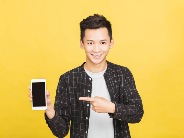 happy young man showing mobile phone screen - Fotó, kép