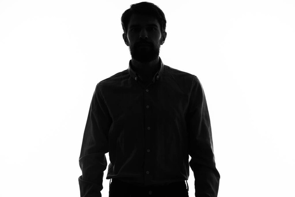 black silhouette of a man on a white background cropped view model - Foto, imagen