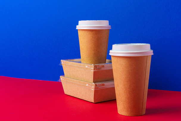 Takeaway food concept. Some packed food in container with coffee cup - Photo, image