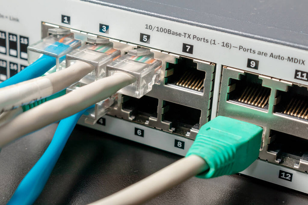 Network switch and UTP ethernet cables. Concept Telcomunication technology. - Photo, Image