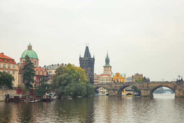 A beautiful view of the Charles bridge from the river Vltava in Prague, Czech Republic - 写真・画像
