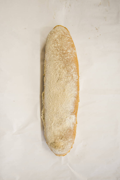 An overhead shot of freshly baked white bread on an isolated background - Foto, afbeelding