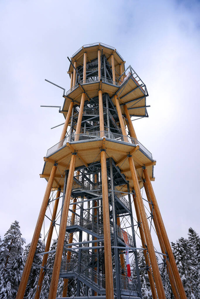 A low angle shot of a yellow tower with three different floors - Foto, afbeelding