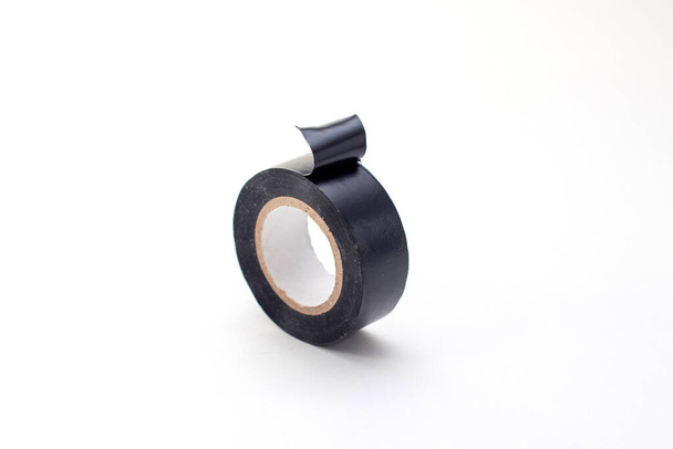 Roll of black insulating tape isolated on a white - Photo, Image
