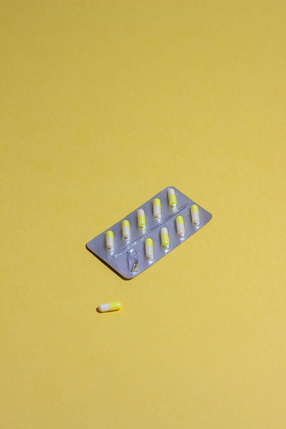 Pills on a yellow background. Medicine. Health Medication - Fotó, kép