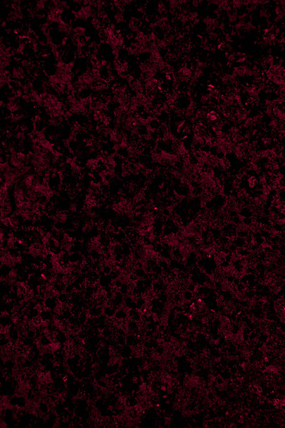Karmínově zbarvené pozadí stěny s texturou různých odstínů karmínově červené - Fotografie, Obrázek