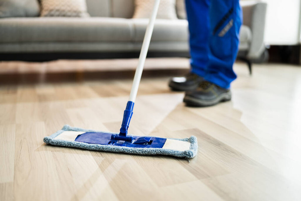 Home Floor Cleaning Service. Man Mopping Living Room - Fotoğraf, Görsel