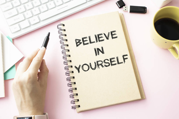 Handwriting text Believe In Yourself. Concept meaning Determination Positivity Courage Trust Faith Belief Advisors hand holding black marker whiteboard written black color words. - Foto, Imagem