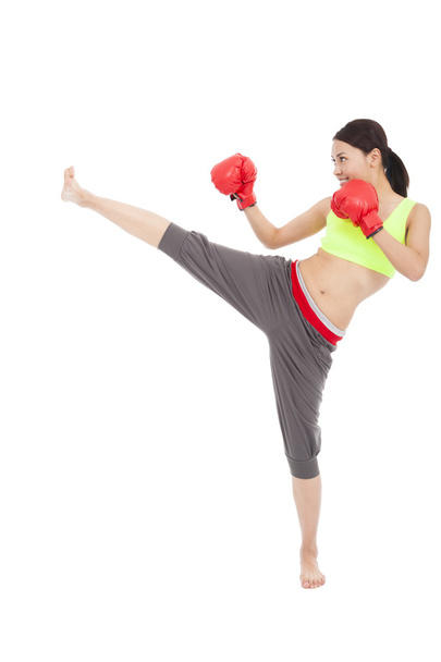pretty sporty woman is kicking - Фото, зображення