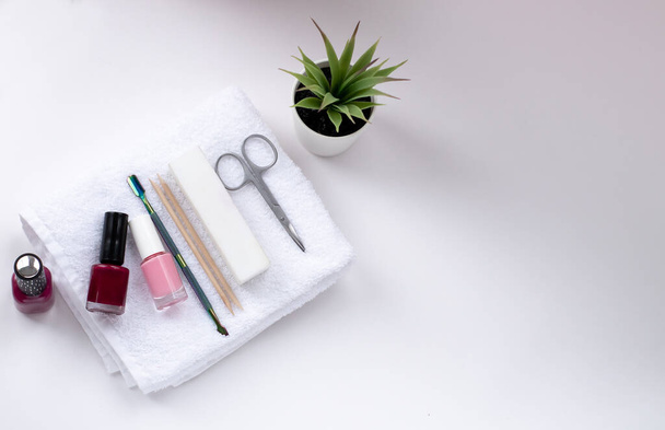 manicure and pedicure equipment for nail bar set on white background top view mockup - 写真・画像
