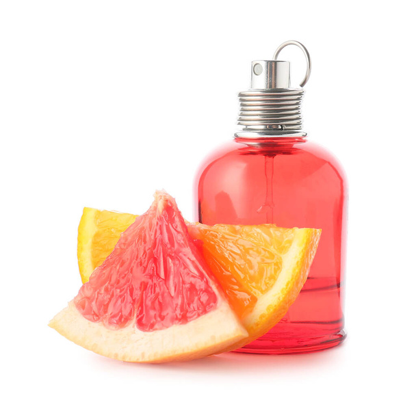 Bottle of perfume with citrus fruits on white background - Fotografie, Obrázek