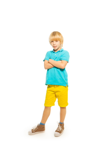 Boy in blue shirt and yellow shorts - 写真・画像