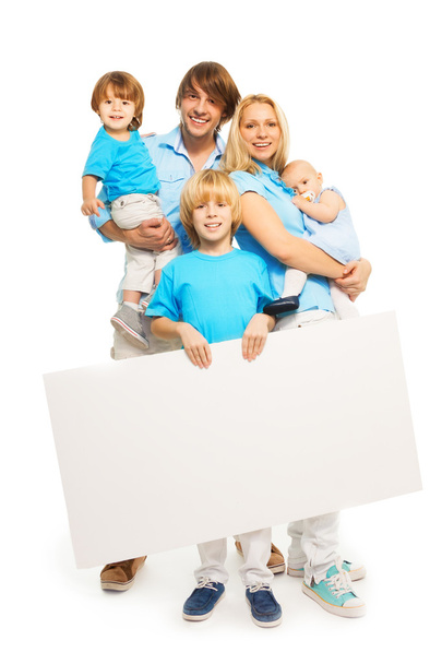 Family holding blank advertisement banner - Foto, afbeelding
