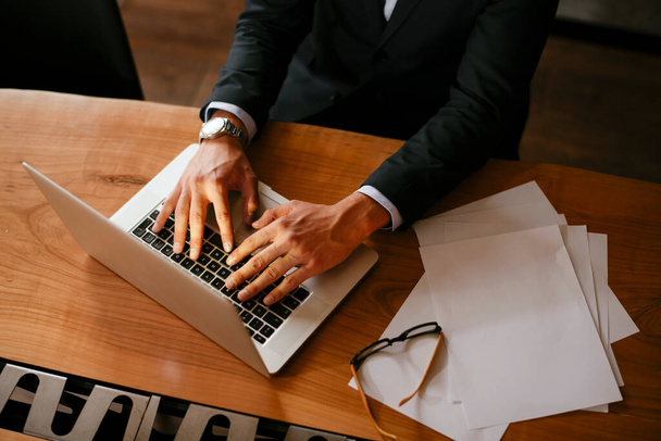 Closeup view of man hands using laptop. Business communication concept. - Photo, Image