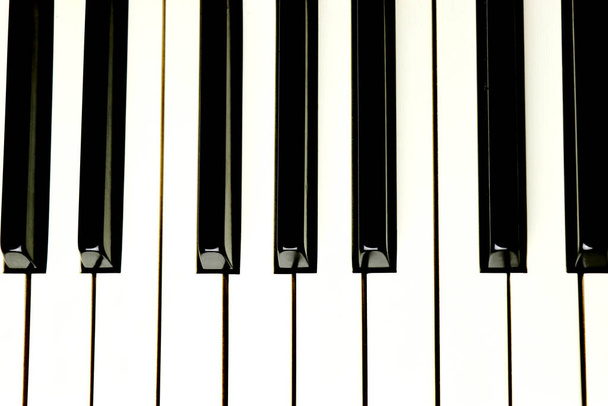 Acoustic piano keys - top angle view - directly above - background - close up - Photo, Image
