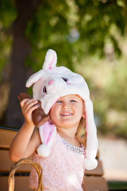 Pretty young girl in a Bunny hat and chocolate - Fotoğraf, Görsel