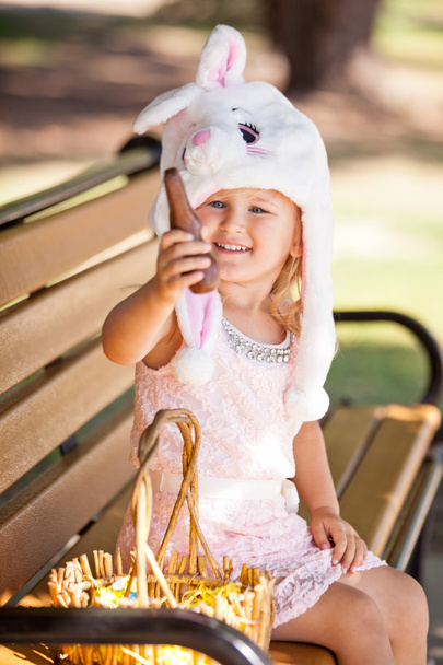 Pretty young girl in a Bunny hat and chocolate - Fotoğraf, Görsel