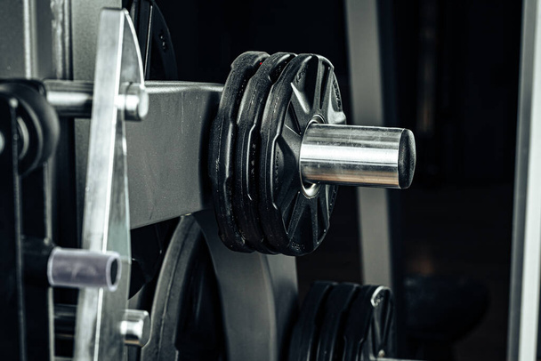 Gym weight plates on holder close up - 写真・画像