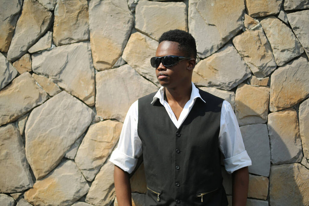 Portrait of young handsome afro black man posing outdoor. - Φωτογραφία, εικόνα