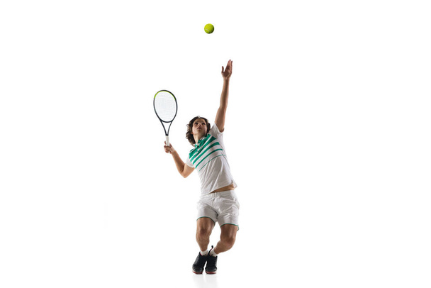 Young caucasian professional sportsman playing tennis isolated on white background - Foto, immagini