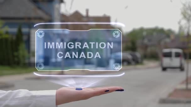 Жінки показують голограму імміграцію в Канаду. - Кадри, відео