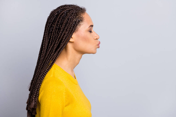 Profile side photo of young attractive afro american woman pouted lips send air kiss isolated over grey color background - Foto, Bild