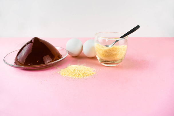 Jelly, gelatin and eggs are the main foods containing collagen, essential for youthful skin and healthy joints. Minimalist concept of proper nutrition. Light pink background. Copy space. - Photo, Image