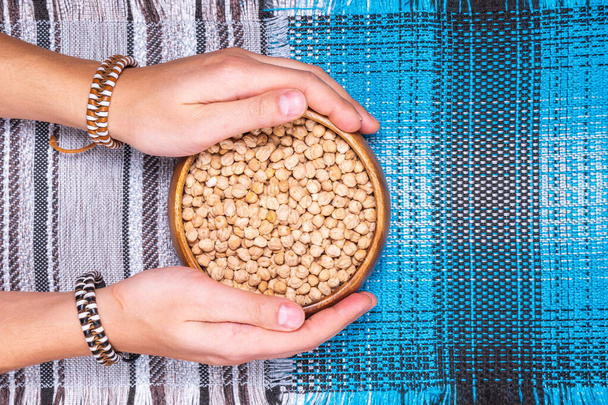 Raw Chickpeas in a bowl. Chickpeas is nutritious food. Healthy and natural vegetarian food. flat lay - Foto, Imagem