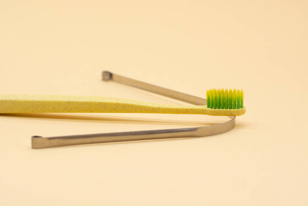 metal scraper or tongue cleaning brush and a toothbrush. Hygiene of the oral cavity - Zdjęcie, obraz