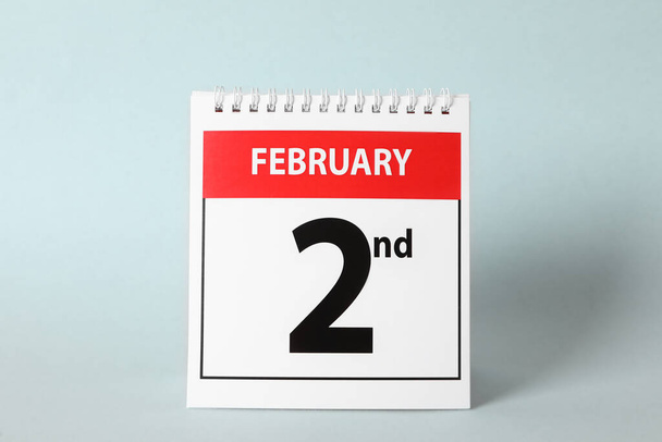 Calendar with date February 2nd on light background. Groundhog day - Φωτογραφία, εικόνα
