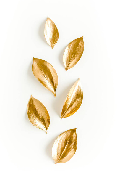 Pattern, texture with gold leaves isolated on white background. flat lay, top view - Фото, изображение