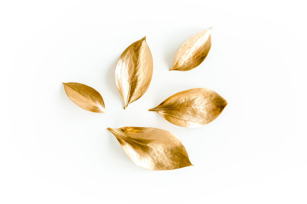 Pattern, texture with gold leaves isolated on white background. flat lay, top view - Zdjęcie, obraz