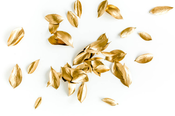 Pattern, texture with gold leaves isolated on white background. flat lay, top view - Foto, Imagem