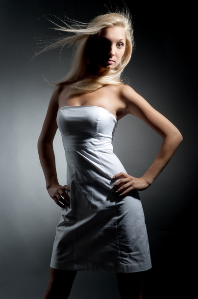Blond girl in white dress - Fotó, kép