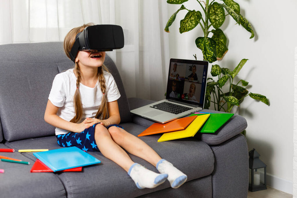 Young little girl with VR virtual reality glasses - Zdjęcie, obraz