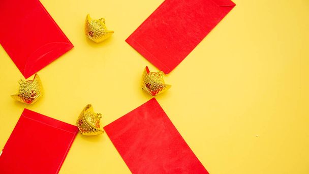 Lunar New Year decoration with lucky gold bar isolated on yellow. Трансляция текста на картинке: удача удачи - Фото, изображение
