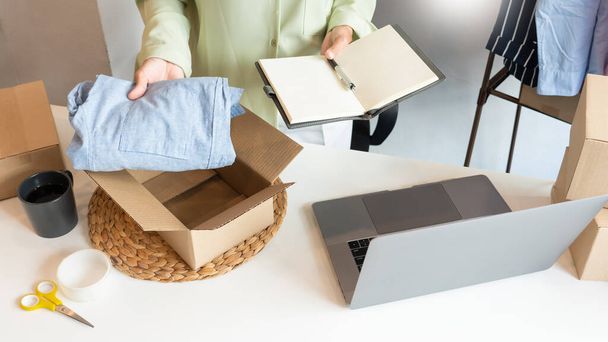 Online small business entrepreneur merchants working at store preparing products to deliver to customers, startup and online business concept - 写真・画像