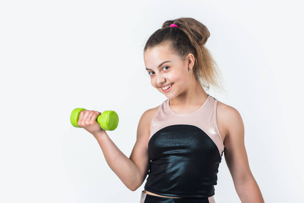 sport and success. healthy lifestyle. concept of fitness. child workout with dumbbell. - 写真・画像