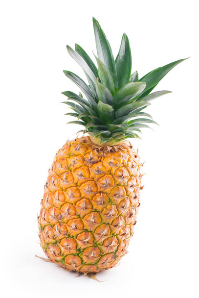 Ripe whole pineapple isolated on white. - 写真・画像