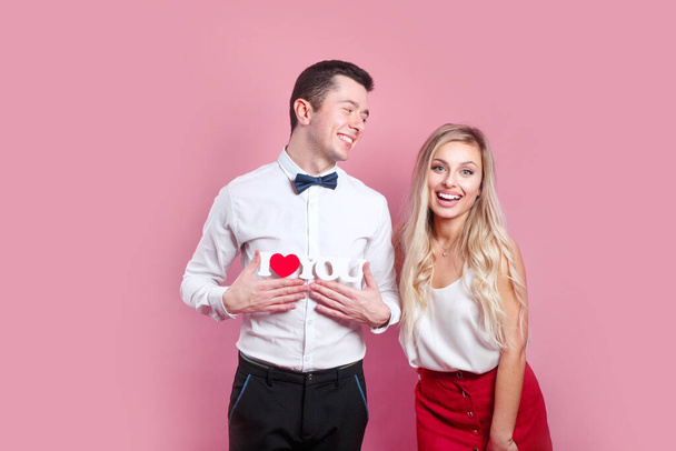 I love you. Happy couple in love on pink background. Happy Valentines day. - Fotografie, Obrázek