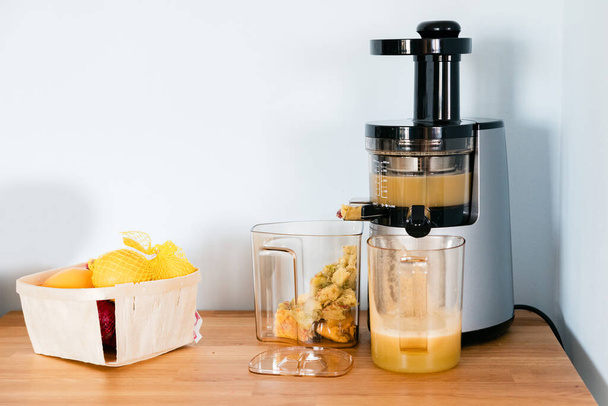 a slow-speed juicer standing on a kitchen counter - Photo, Image